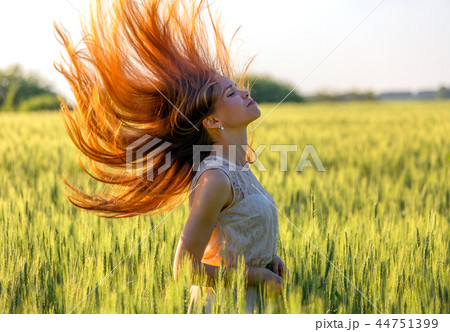 girl with blowing red hair girl with blowing red hair 44751399