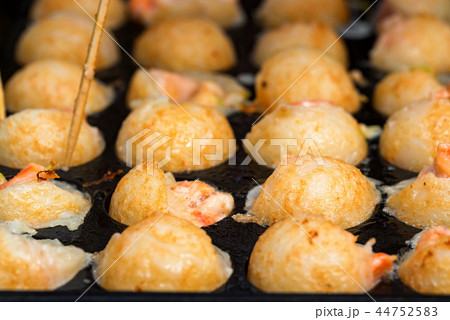 Close up baking prawns in baking pan with holes Close up baking prawns in baking pan with holes 44752583