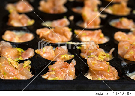 Close up baking prawns in baking pan with holes Close up baking prawns in baking pan with holes 44752587