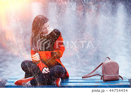 autumn sun rays adult girl outdoor / girl in autumn in a Scottish plaid posing outdoor in a park on a sunny day 44754454