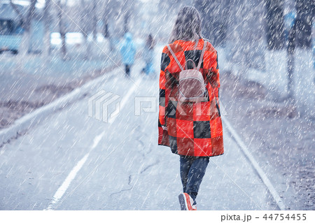 rainy weather girl posing fall / raindrops, spray, girl adult on a rain background rainy weather girl posing fall / raindrops, spray, girl adult on a rain background 44754455