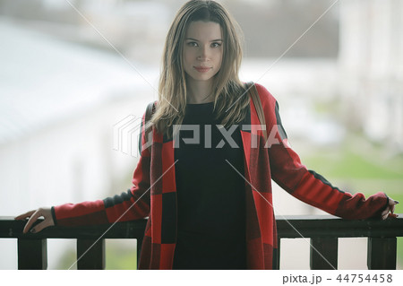 girl in coat outdoor / autumn photo model girl adult posing in park, girl in coat with long hair girl in coat outdoor / autumn photo model girl adult posing in park, girl in coat with long hair 44754458