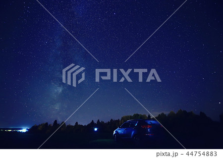 night scenery of a star and a machine, an adventure in the night scenery, the milky way above travelers 44754883