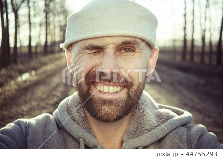man with backpack, tourist, brutal journey, hike, the concept of active male recreation, portrait of a severe, brutal man, guy preparing equipment for the mountains 44755293