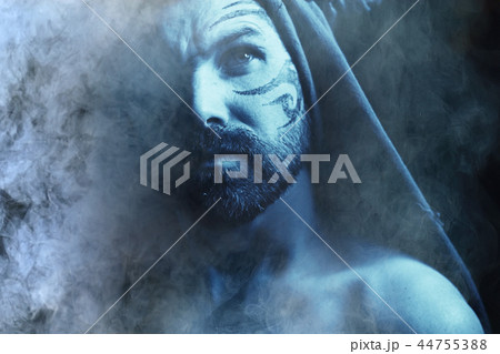 man's portrait in smoke, smoke from a hookah and a brutal guy. Unusual bearded man, portrait man's portrait in smoke, smoke from a hookah and a brutal guy. Unusual bearded man, portrait 44755388