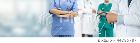 Doctor working in hospital with other doctors. 44755787
