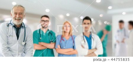 Doctor working in hospital with other doctors. 44755835
