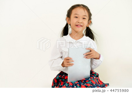 Little kid on white background with tablet. Little kid on white background with tablet. 44755980