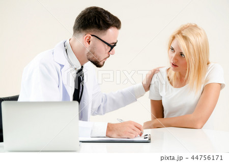 Male Doctor and Female Patient in Hospital Office Male Doctor and Female Patient in Hospital Office 44756171