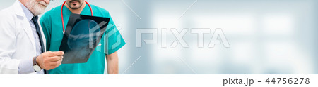 Doctors at hospital working with another doctor. Doctors at hospital working with another doctor. 44756278