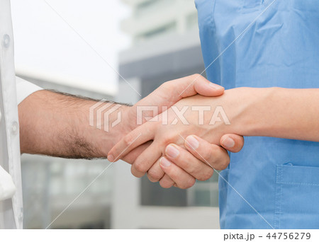 Doctor in hospital handshake with another doctor. Doctor in hospital handshake with another doctor. 44756279