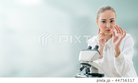 Scientist researcher uses microscope in laboratory 44756317