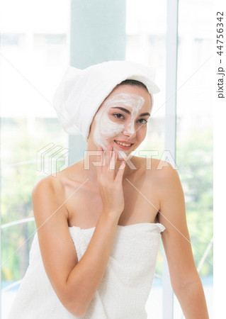 Beautiful woman having a facial treatment at spa. 44756342