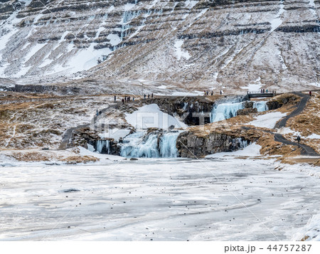 Kirkjufellfoss waterfall in winter, Iceland Kirkjufellfoss waterfall in winter, Iceland 44757287
