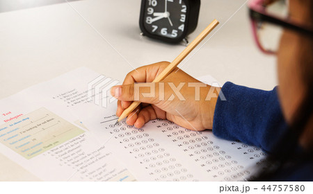 student's hand taking English test in class student's hand taking English test in class 44757580