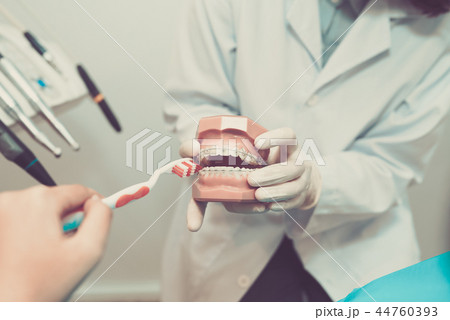 Brushing teeth with braces Brushing teeth with braces 44760393