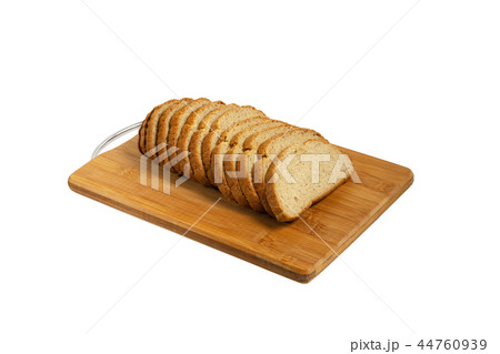 Sliced bread on a board. 44760939