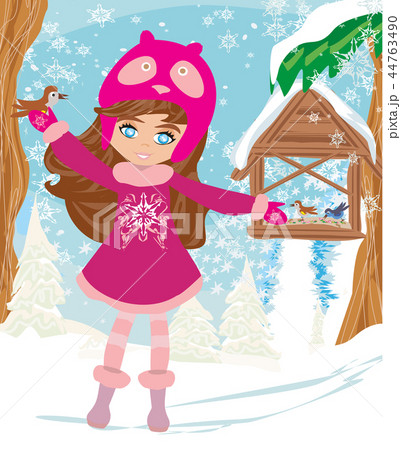 Girl feeds the birds in winter Girl feeds the birds in winter 44763490