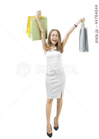 Happy asian woman holding shopping bags 44764044