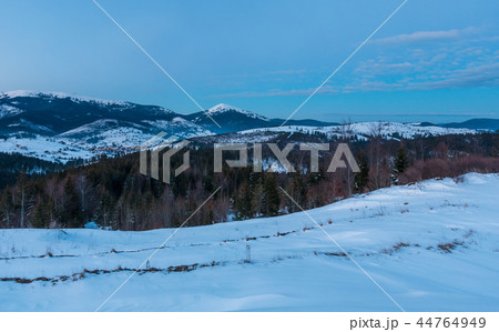 Evening twilight winter mountain ridge panorama 44764949