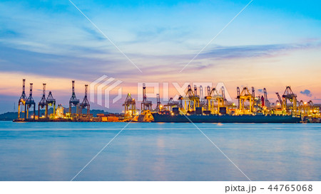 Freighter ship loading cargo at loading dock. Freighter ship loading cargo at loading dock. 44765068