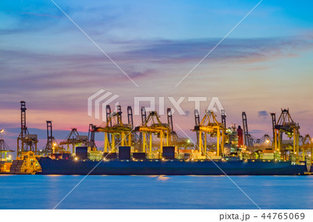 Freighter ship loading cargo at loading dock. Freighter ship loading cargo at loading dock. 44765069