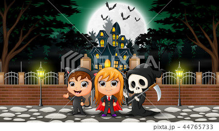 Happy halloween group celebrate in front of haunte Happy halloween group celebrate in front of haunte 44765733