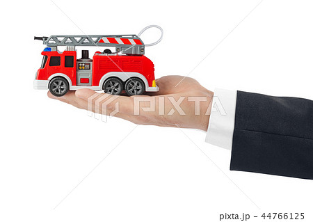 Hand with fire truckの写真素材 [44766125] - PIXTA