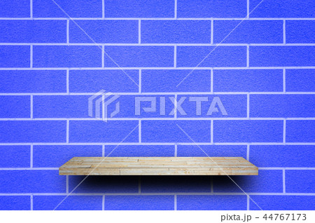 Empty rock stone shelf on blue wall background 44767173