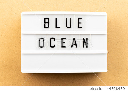 Light box with word blue ocean on wood background Light box with word blue ocean on wood background 44768470