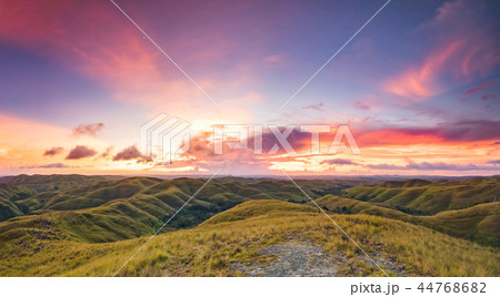 Grassland on the sunset sky background. Indonesia. Grassland on the sunset sky background. Indonesia. 44768682