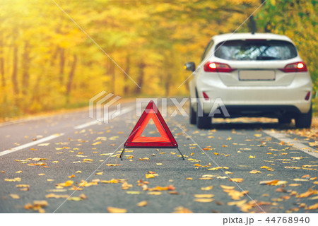 Broken car concept, breakdown triangle on road Broken car concept, breakdown triangle on road 44768940