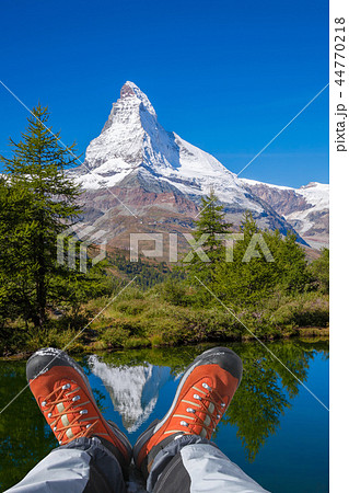 Matterhorn peak with hiking boots in Swiss Alps. Matterhorn peak with hiking boots in Swiss Alps. 44770218