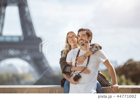 Paris Eiffel tower romantic couple embracing kissing in front of Eiffel Tower, Paris, France. 44771002