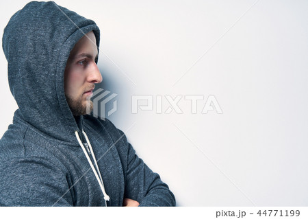 Brutal naked muscular man dressed in a grey hoodie 44771199