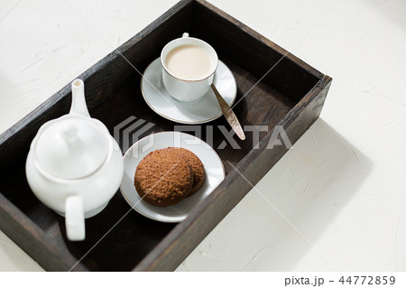 Breakfast, wooden tray of tea and oatmeal cookies 44772859