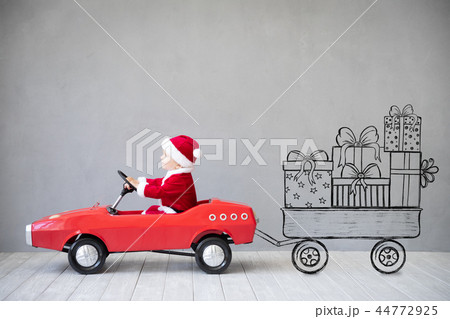 Baby boy having fun on Christmas time Baby boy having fun on Christmas time 44772925