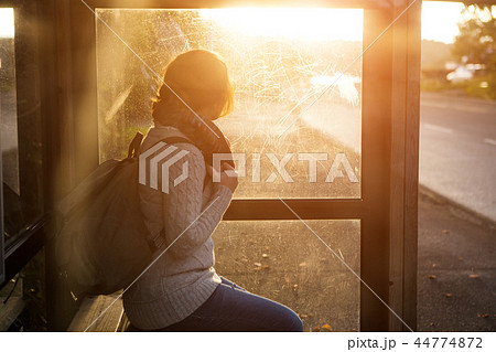 Girl on a bus stop 44774872