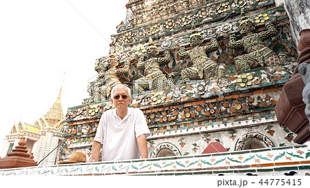 Asian senior man visiting wat pho sculptures  44775415