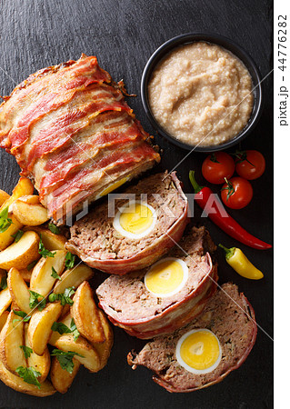 Hackbraten Meat loaf with egg served with potato Hackbraten Meat loaf with egg served with potato 44776282