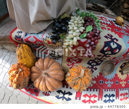 Artificial melons and grapes from plastic lie on a towel Artificial melons and grapes from plastic lie on a towel 44776305