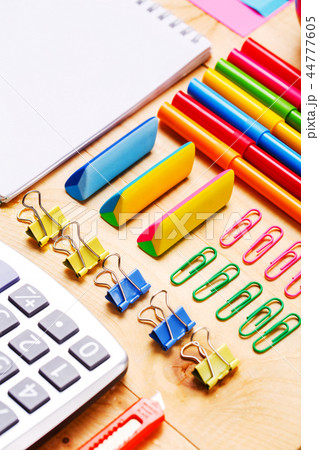 The office stationery is laid out on the secretary table 44777605