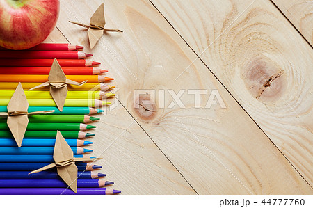 Colorful pencils on the left side of the background Colorful pencils on the left side of the background 44777760