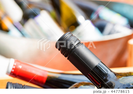 Close up of full and corked bottles of wine Close up of full and corked bottles of wine 44778615