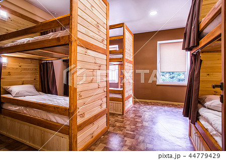 Bunk wooden beds in the comfortable hostel 44779429