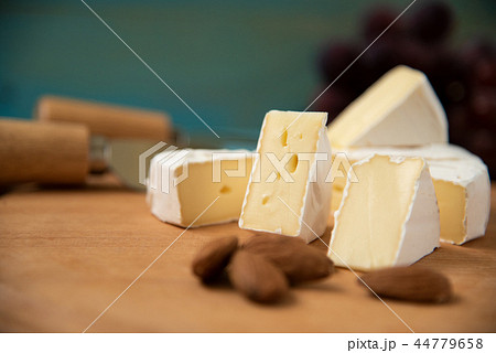 cheese camembert with raspberries and nuts, melange cheese camembert with raspberries and nuts, melange 44779658