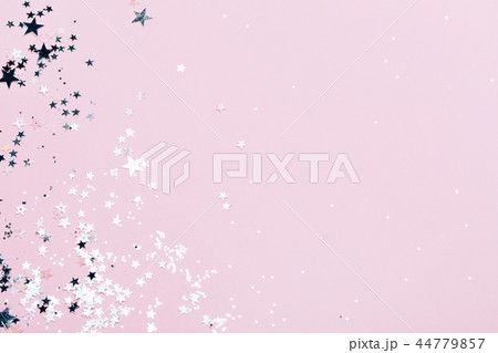 Silver sparkles on pink background 44779857