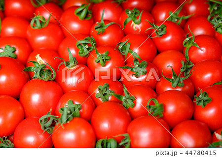 Fresh red tomato abstract fruit colorful pattern texture background. Shallow depth of field. Fresh red tomato abstract fruit colorful pattern texture background. Shallow depth of field. 44780415