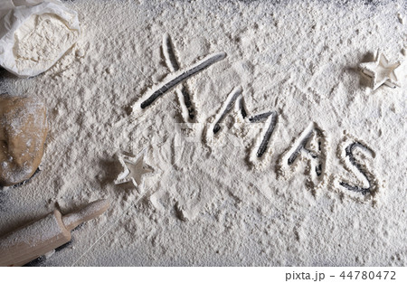Xmas written in white flour 44780472