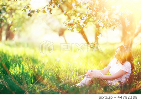 spring girl apple flowers, nature portrait of happy girl with long hair in blooming apple trees, freedom purity concept of happiness spring girl apple flowers, nature portrait of happy girl with long hair in blooming apple trees, freedom purity concept of happiness 44782388